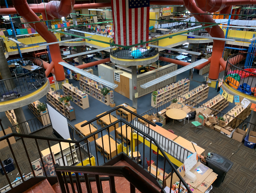 (ELEANOR BERGSTEIN/CYPRESS STAFF) Unit A of the Pierce School. Over ten classrooms and over two hundred students occupy this space, with most classrooms divided by bookshelves or other makeshift dividers. The space also holds the library (pictured in the center) on the first floor, various offices and learning spaces and reading nooks.
