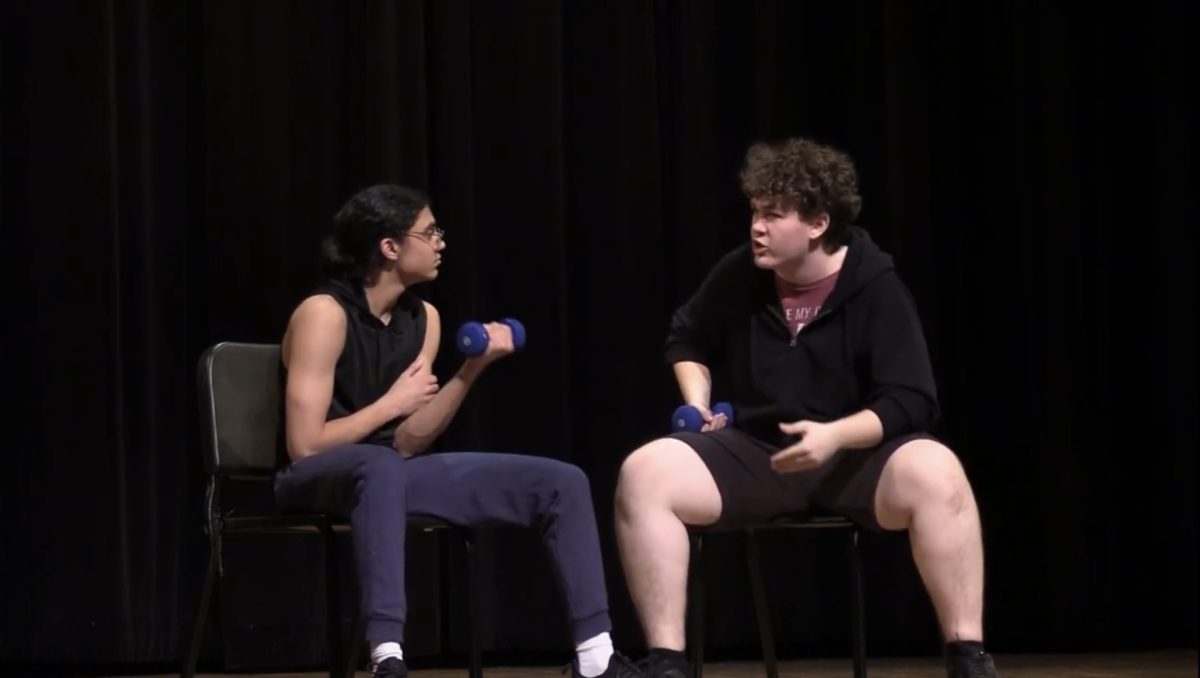 Junior Rafay Ali and senior Ian Hansen a
play the role of two bodybuilder podcast hosts in "Da Boyz," a scene focused on highlighting male mental health.