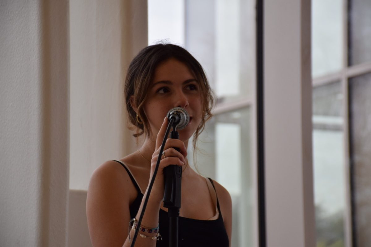 Junior Natalie Tulipani read her original poem “Familiarity” before the 19th Annual Poetry Fest crowd, which took place on May 8th, 2024.