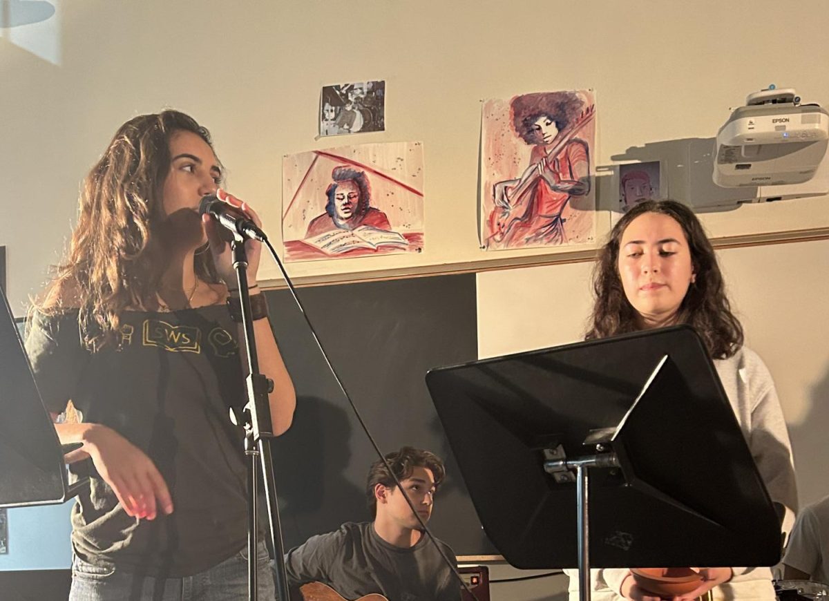 Juniors Ingrid Aumiller and Rose dela Paz participated in the first Open Mic Night of the year on Sept. 20: an evening that showcased all kinds of live music.