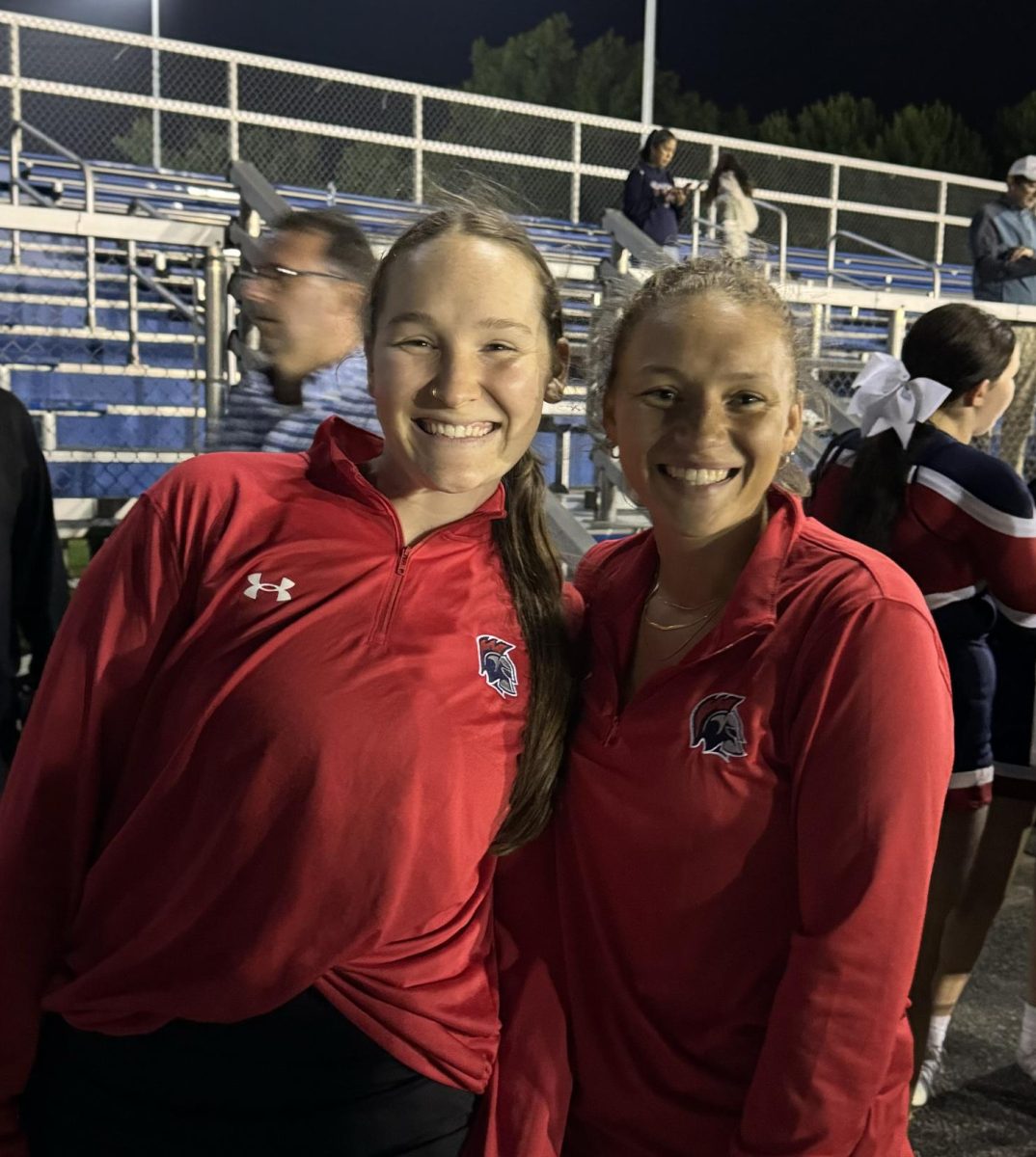 Kendall Murray (Left) and Neva Taylor (Right) pose for a photo after their first sideline cheer game as coaches