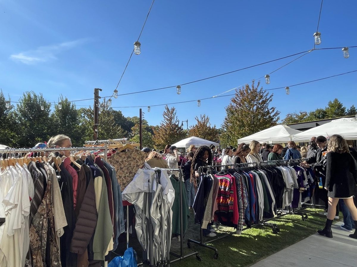 Shoppers sift through racks of unique fashion pieces, eager to find an item that suits them.