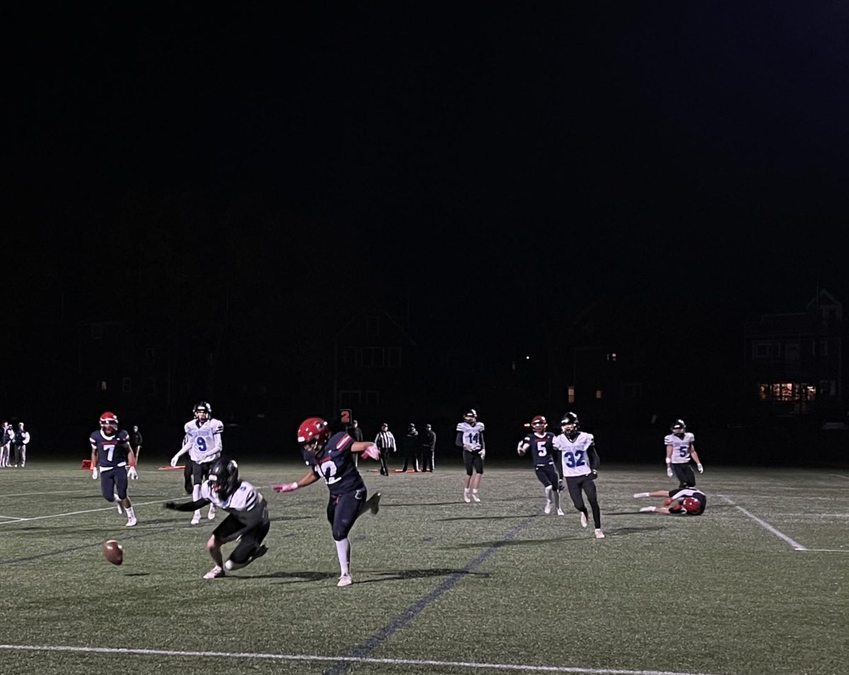 Senior and captain Mustafa Mohammed chases looks to the ball as it is dropped by the Raiders. The Warriors beat the Raiders 33-8 on Friday, Nov. 15 for their senior night. 