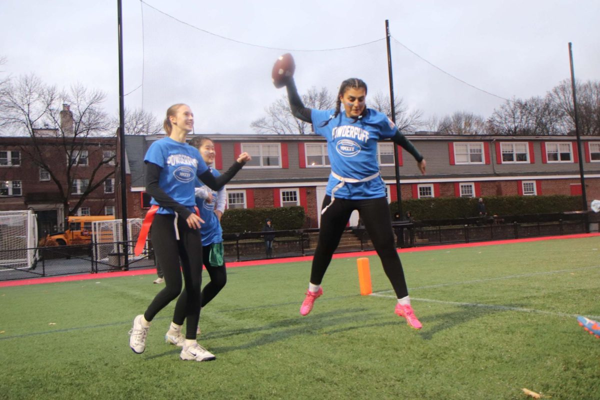 Senior quarterback Nai Azzi spikes the football after scoring the first touchdown of the annual Powderpuff game on Tuesday, Nov. 26.