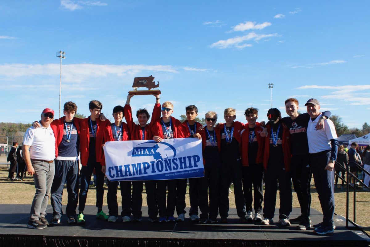 Boys varsity cross country won the MIAA State Championships on Saturday, Nov. 16 at Willard Park. After their win the team gathered to take pictures and celebrate a hard-fought season. 