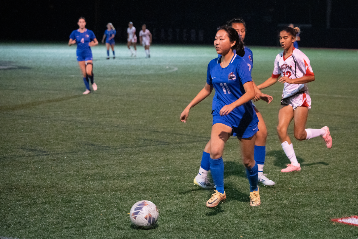 Senior and left winger Nora Sheu dribbles the ball up the field. Girls varsity soccer beat the Brockton Boxers 10-1 on Tuesday, Nov. 5. With this win, the Warriors advanced to the round of 16.