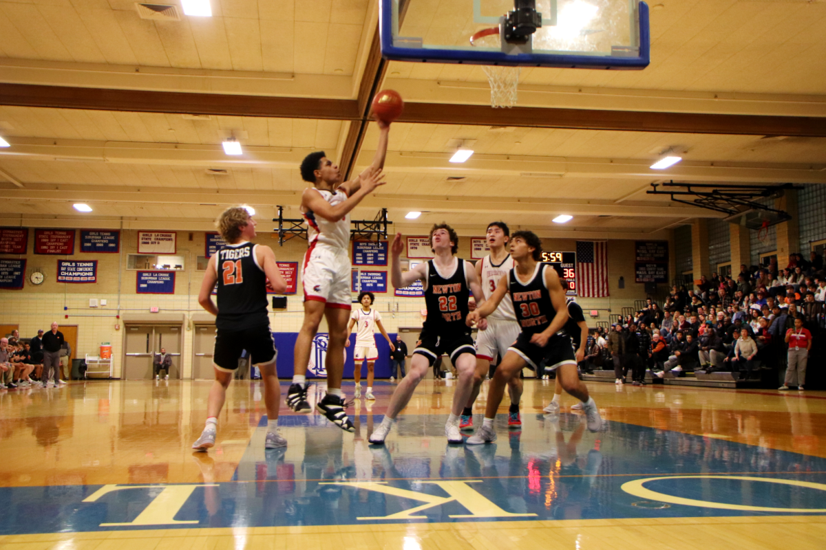 The Warriors lost in hard-fought game against the Newton North Tigers on Friday, Jan. 3, in the Schluntz Gymnasium.