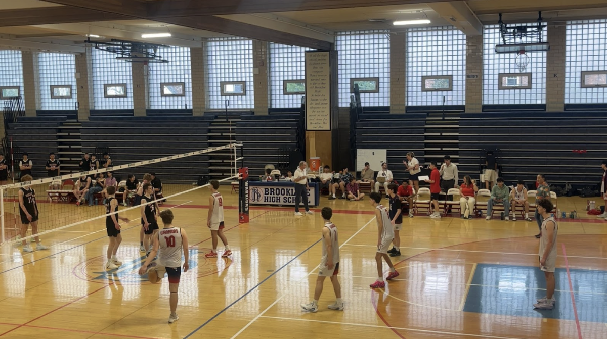 The boys varsity volleyball team, seen here in their recent game against the Wellesley Raiders, are in the midst of an undefeated season. The Warriors recently defeated their rivals the Newton North Tigers in a decisive win.