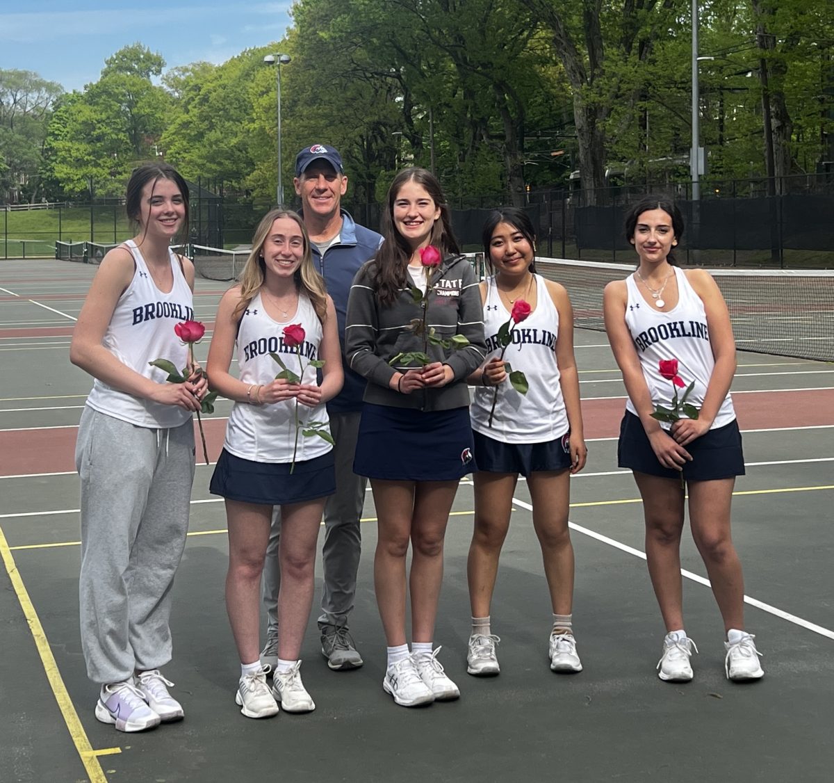 The girls varsity tennis team celebrated their senior night with their last home game of the season on Wednesday, May 13, at the Waldstein Courts in Dean Park. This game was threatened by rain, but the Warriors were ultimately able to play.