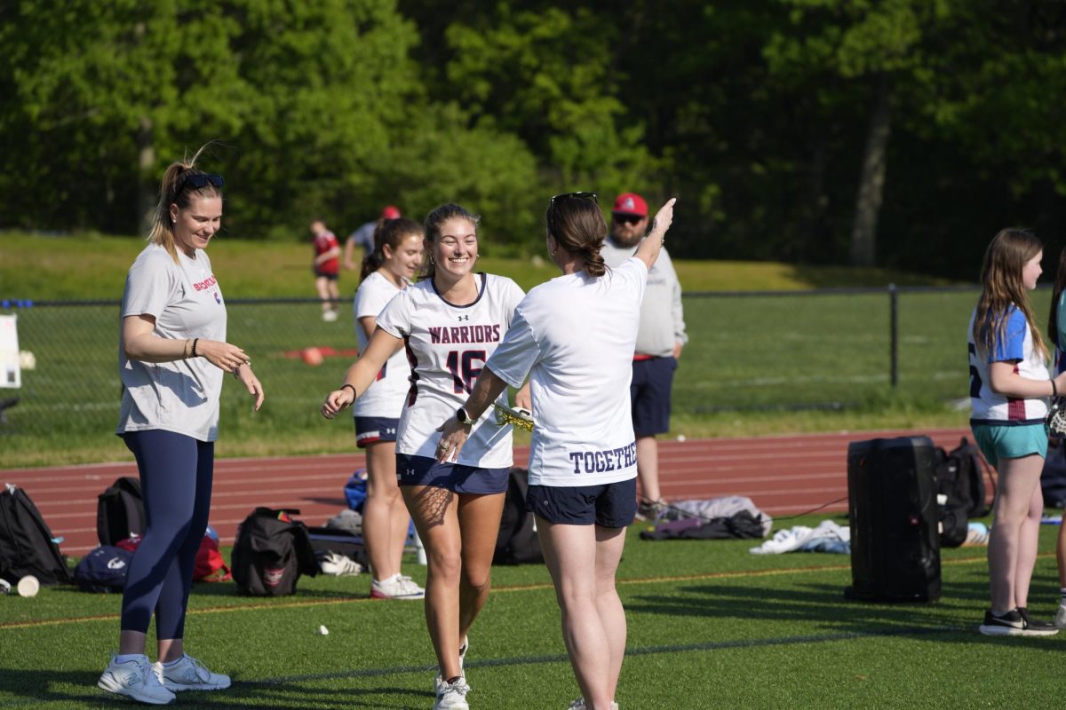 The girls varsity lacrosse lost a hard-fought match against the Braintree Wamps on Monday, May 18, at Downes Field. This game also served as the Warrior's senior night. 
