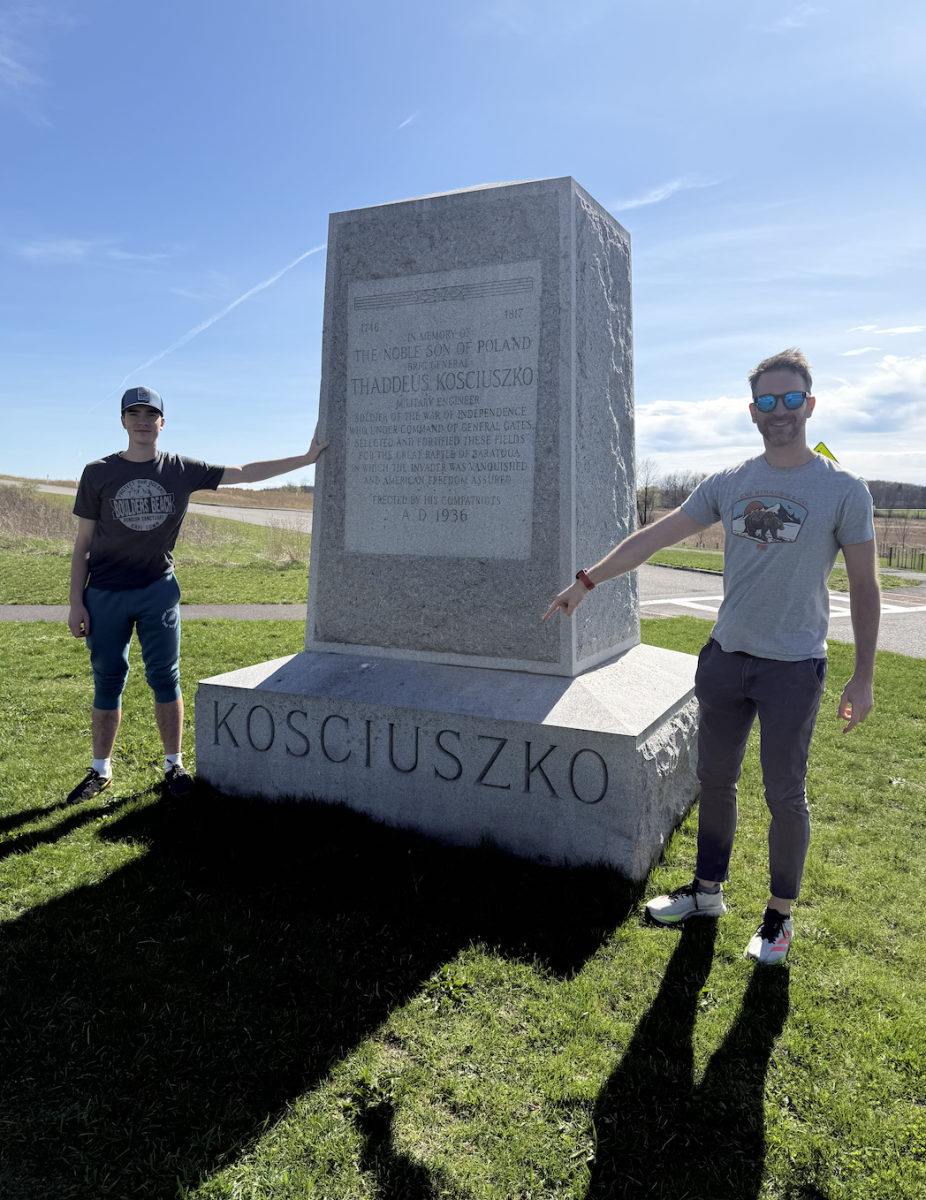 Contributing writer Jakub Paul stands with his father in front of a war memorial for Polish military engineer Thaddeus Kościuszko at Saratoga Battlefield. Kościuszko played an important but little-known role in the American Revolution. 