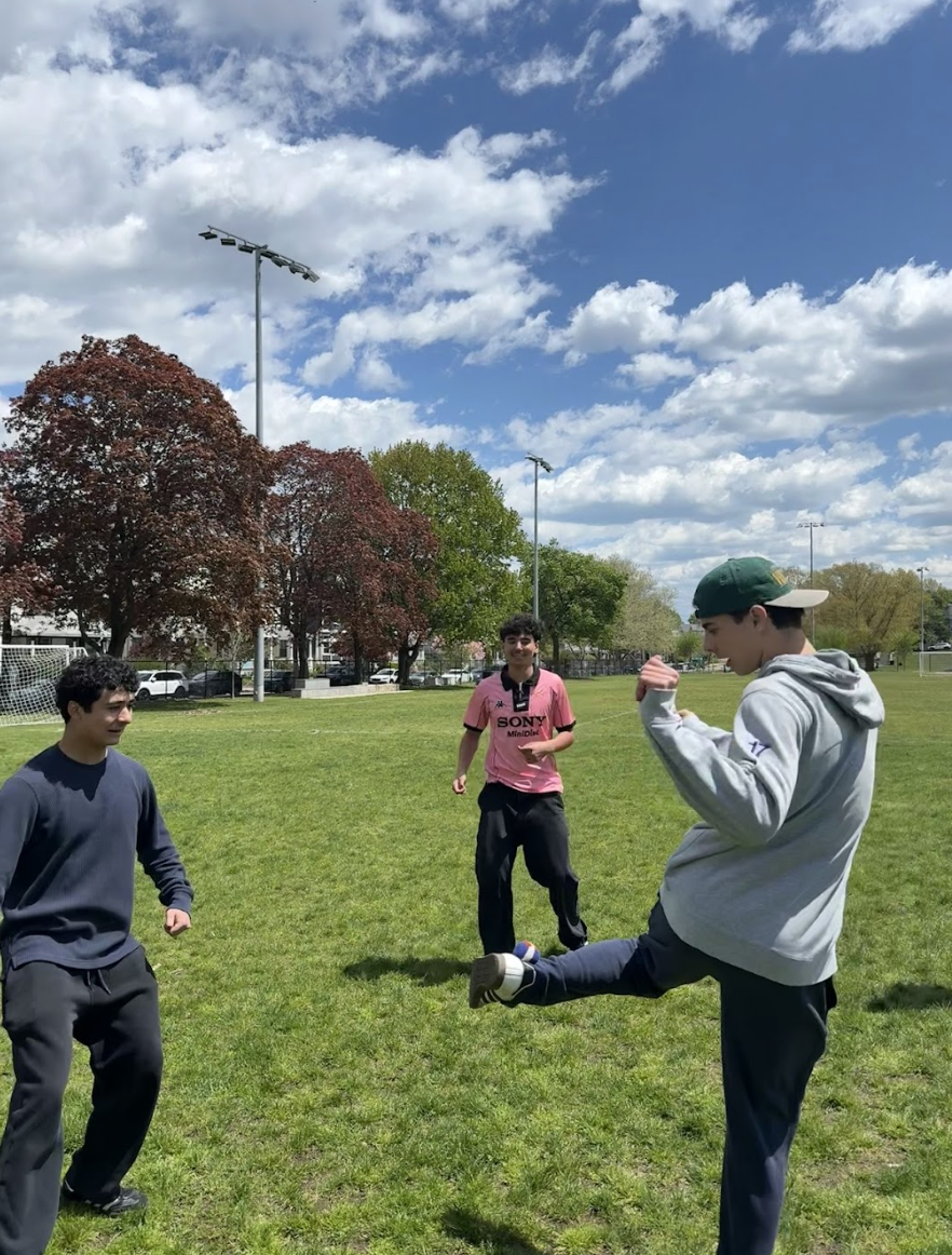 Juniors Paya Osmani, Harry Hatz, Kunon Jon Borowski and Oliver Melton play a game of hacky sack during lunch on a Friday. The pastime has taken off at the high school in recent weeks, due to a social media trend. 